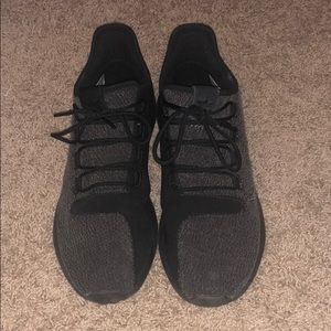 Black adidas athletic shoes